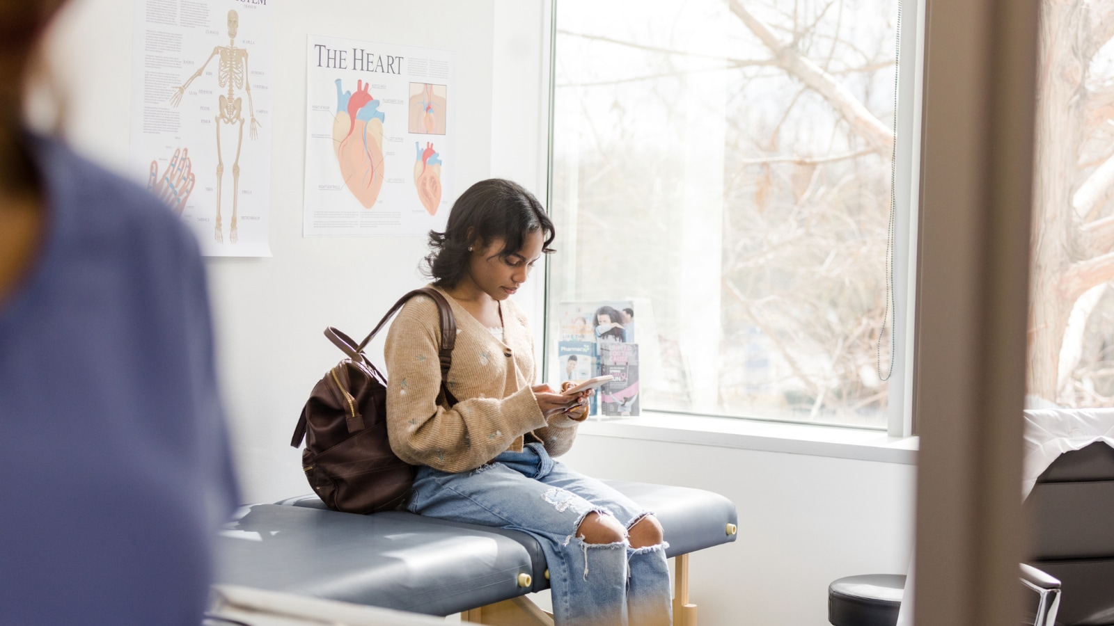 September 25 blog Young female college student sitting in doctor's office